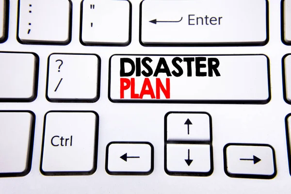 Hand writing text caption inspiration showing Disaster Plan. Business concept for Emergency Recovery written on white keyboard key with copy space. Top view.