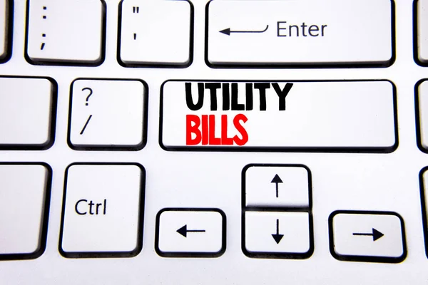 Hand writing text caption inspiration showing Utility Bills. Business concept for Money Bill Payment written on white keyboard key with copy space. Top view.