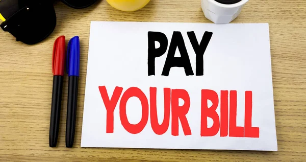 Handwritten text caption showing Pay Your Bill. Business concept writing for Payment for Goverment written on sticky note with copy space on old wood wooden background with sunglasses — Stock Photo, Image