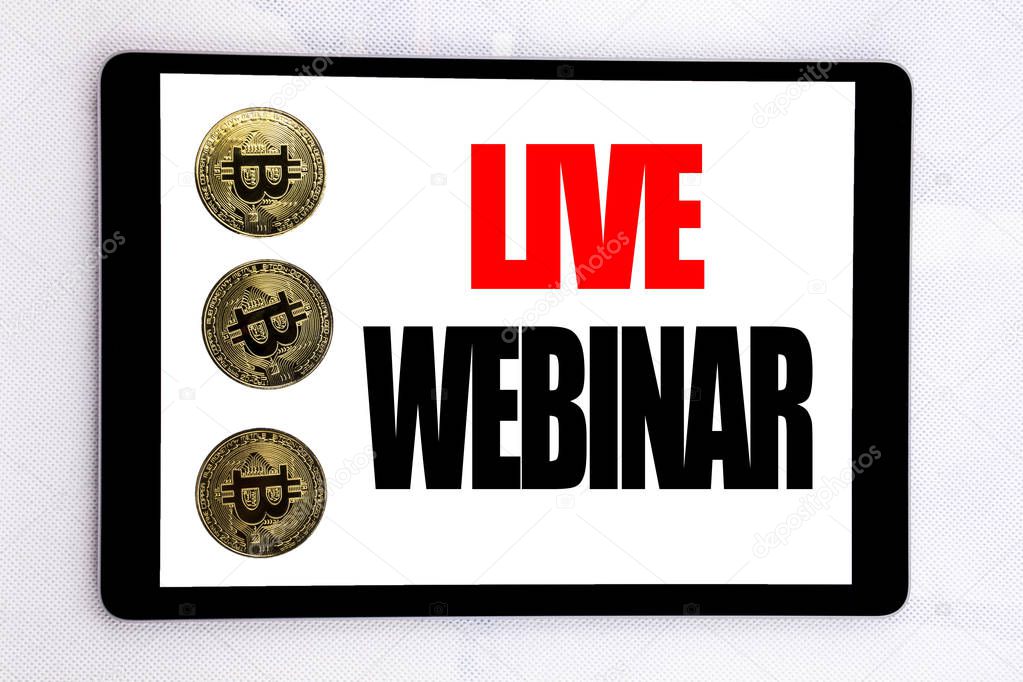 Writing text showing Live Webinar. Business concept for Business Web E-learning written on tablet screen on the white background with cryptocurrency bitcoin next to it.