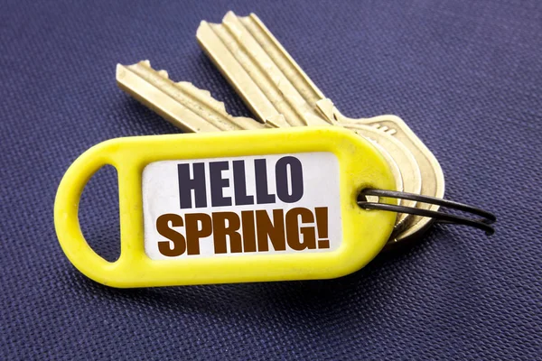 Handwriting Announcement text showing Hello Spring . Business concept for Summer Time Welcoming Written on key holder note black background with space close up — Stock Photo, Image