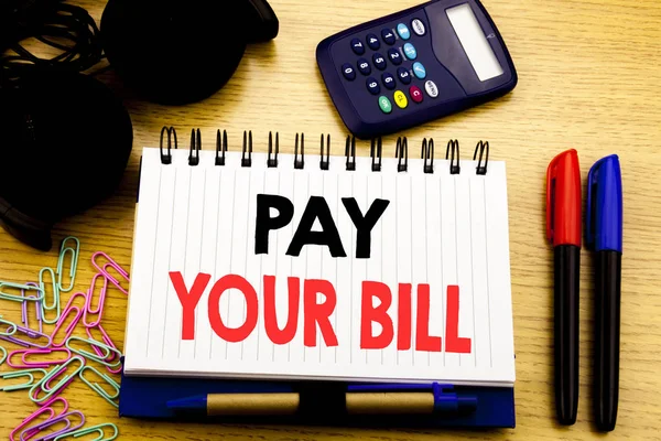 Conceptual hand writing text caption showing Pay Your Bill. Business concept for Payment for Goverment written on notebook book on the wooden background in Office with laptop coffee — Stock Photo, Image