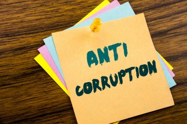 Hand writing text caption inspiration showing Anti Corruption. Business concept for Bribery Corrupt Text written on sticky note paper on the wooden background. clipart