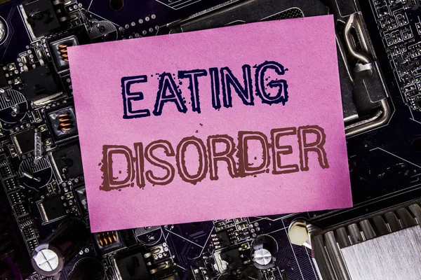 Conceptual hand writing text caption inspiration showing Eating Disorder. Business concept for Medical Problem Written on sticky note, computer main board background. — Stock Photo, Image