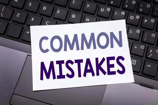 Hand writing text caption inspiration showing Common Mistakes. Business concept for Common Concept written on sticky note paper on the black keyboard background. — Stock Photo, Image