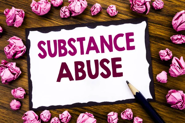 Hand writing text caption inspiration showing Substance Abuse. Business concept for Health Medical Drug Written on sticky note paper, wooden background with folded pink paper meaning thinking