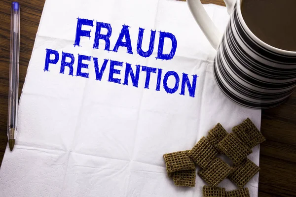 Hand writing text caption showing Fraud Prevention. Business concept for Crime Protection written on tissue paper on the wooden background with pen and healthy coffee in the restaurant