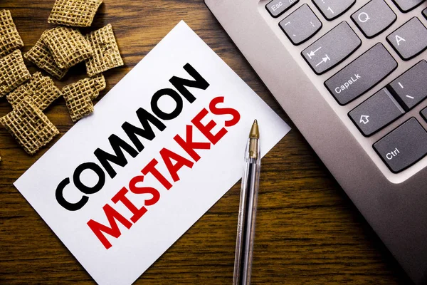 Handwriting Announcement text showing Common Mistakes. Business concept for Common Concept written on sticky note paper on the wooden background next to the laptop keyboard — Stock Photo, Image