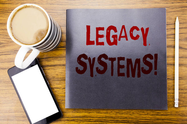 Текст объявления о почерке, показывающий систему Legacy Systems. Business concept for Upgrade SOA Application Written on Notepad note paper, wooden wood background with coffee pen and cell phone
