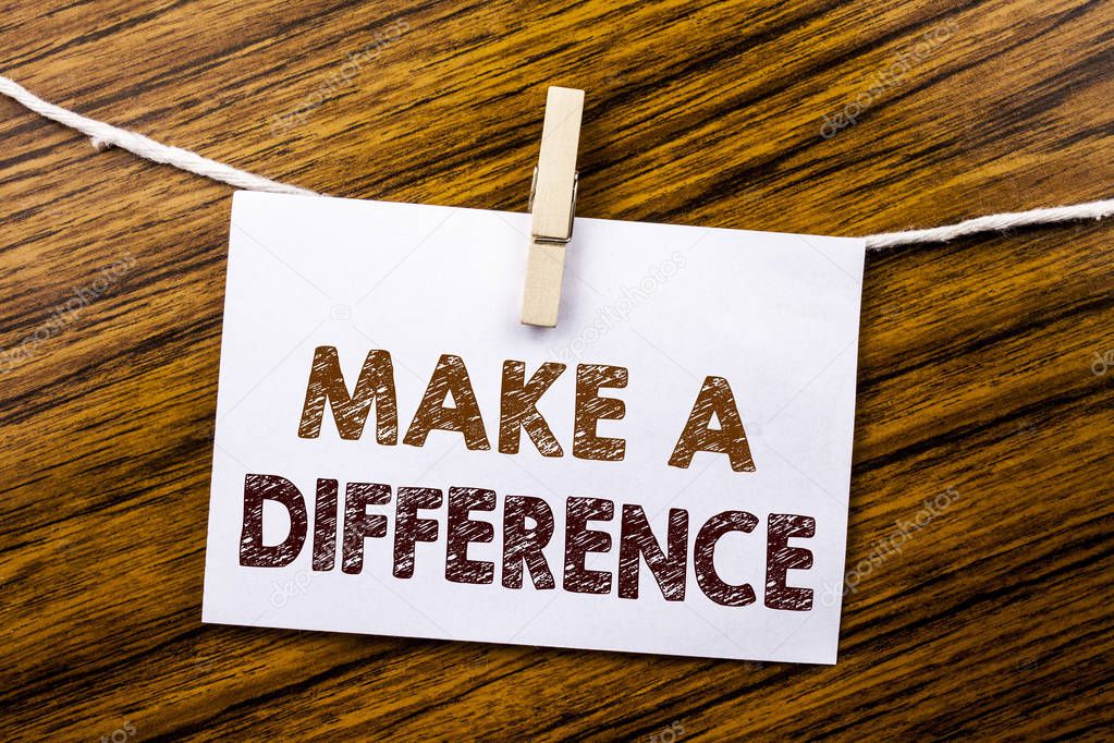 Handwriting Announcement text showing Make A Difference. Business concept for Motivation Success written on sticky note paper on the wooden background.