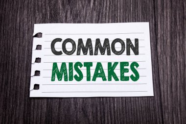 Word, writing Common Mistakes. Business concept for Common Concept written on sticky note paper on the dark wooden background. Black and green. clipart