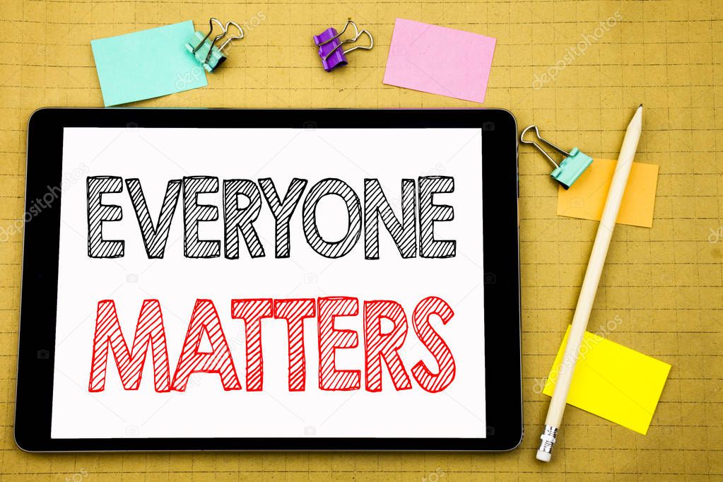 Word, writing Everyone Matters. Business concept for Equality Respect Written on tablet laptop, wooden background with sticky note and pen