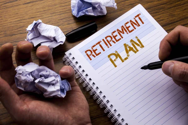 Word, writing Retirement Plan. Concept for Pension Finance written on notebook notepad note paper on the wooden background with folded paper meaning thinking for idea. Man hand and marker. — Stock Photo, Image