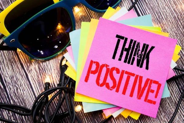 Word, writing Think Positive. Business concept for Positivity Attitude written on sticky note with copy space on old wood wooden background with sunglasses — Stock Photo, Image