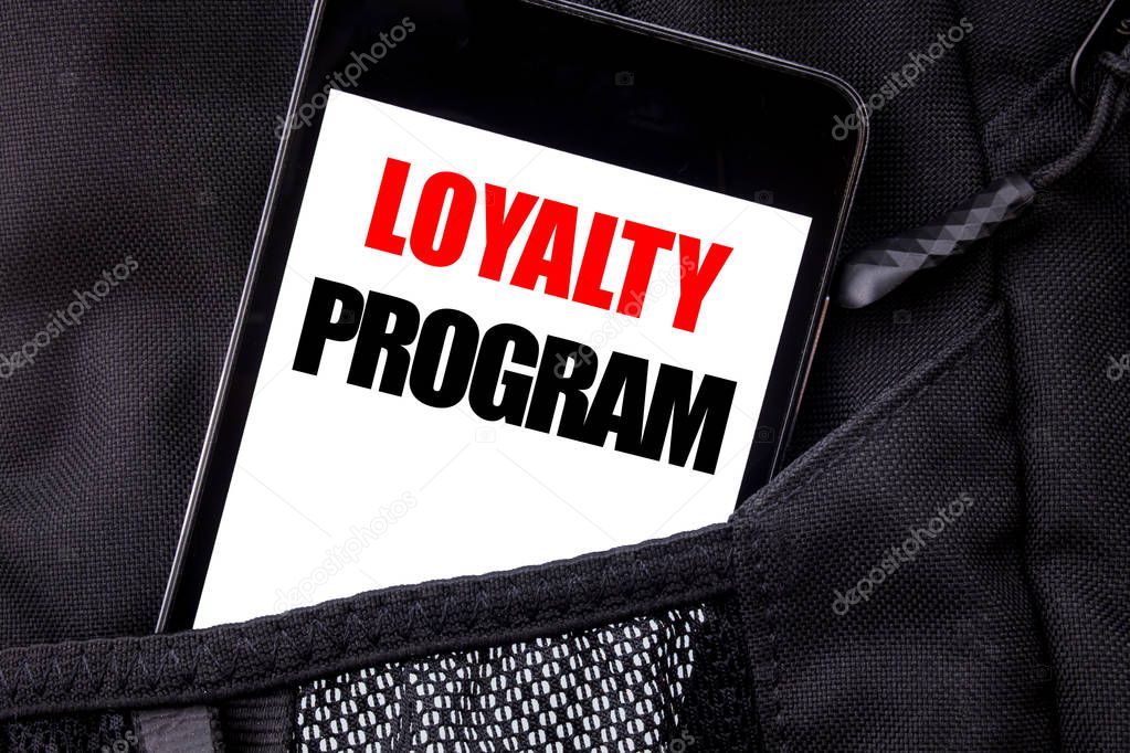 Handwritten text showing Loyalty Program. Business concept writing for Marketing Concept Written phone mobile phone, cellphone placed in the man front jeans pocket.