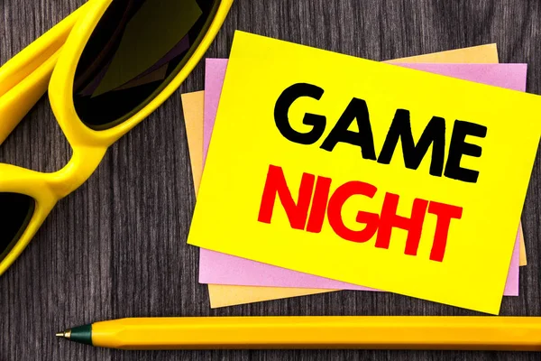 Conceptual hand text showing Game Night. Business photo showcasing Entertainment Fun Play Time Event For Gaming written on Stiky Note Paper with Pen on the wood background. — Stock Photo, Image