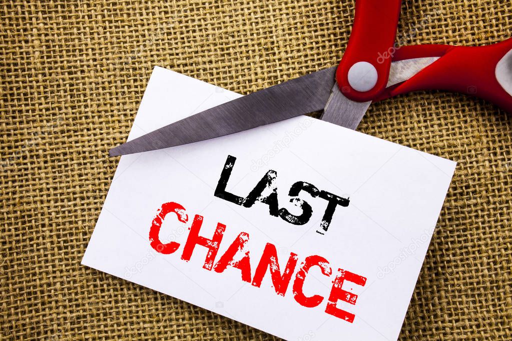 Handwriting text showing Last Chance. Conceptual photo Announcement Alert Time or Deadline Ending written on Sticky Note Paper Cutting by Scissors on the textured background