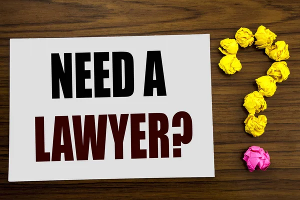 Hand writing text caption inspiration showing Need A Lawyer. Business concept for Advocacy Justice Help written on white note paper on the wooden background with question mark on the end. — Stock Photo, Image