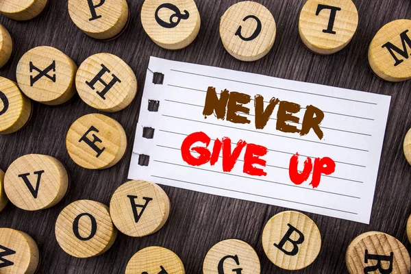 Word, writing, text  Never Give Up. Conceptual photo Motivation Quote For Success Achievement Challenge written on tear notobook paper on the wooden background with letters. — Stock Photo, Image