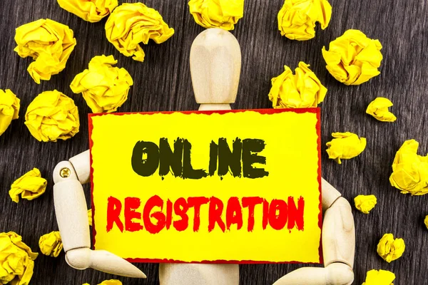 Announcement text showing Online Registration. Concept meaning Register Web Subscription Subscribe written on Sticky Note Holding By Sculpture on the wooden background