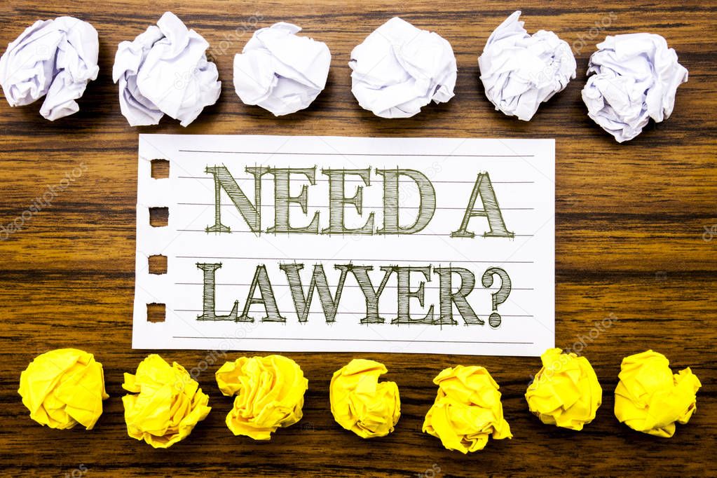 Handwritten text showing Need A Lawyer. Business concept for Advocacy Justice Help Written on sticky note, wooden with sticky, many folded paper white and yellow for difference or collaboration