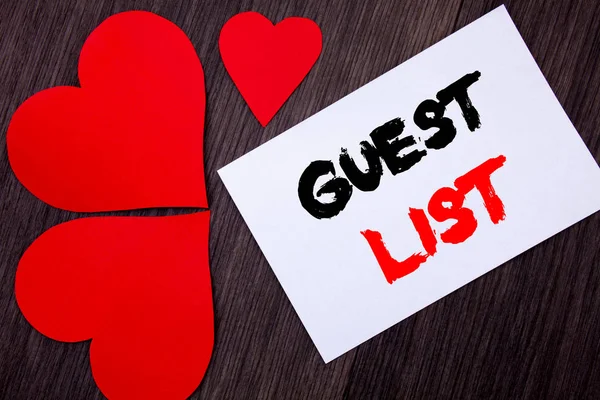 Writing text showing  Guest List. Concept meaning Planning Wedding Or Event Important Guests Lists written on notobook paper note on the wooden background with Love Heart.