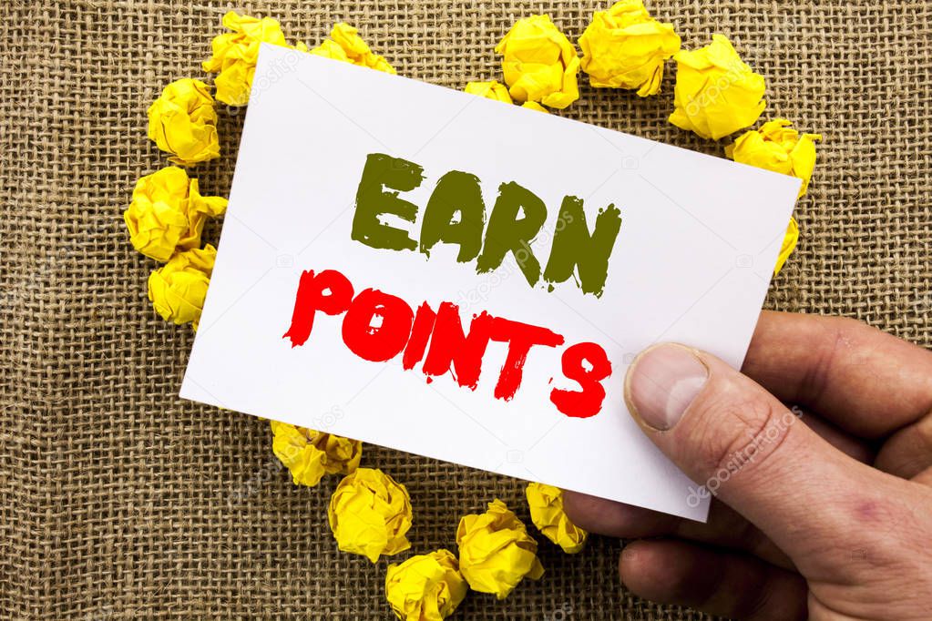 Handwritten text sign showing Earn Points. Conceptual photo Loyalty Reward Benefit Program For Earning Customer Point written on Sticky Note Paper With Heart Holding Hand with Finger.