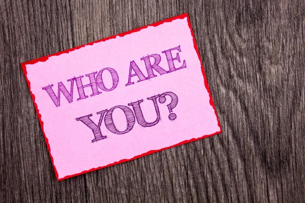 Handwriting Announcement text showing Who Are You Question. Conceptual photo Personality Identity Profile, About Me Or You  written on Pink Sticky Note Paper on the wooden background. — Stock Photo, Image