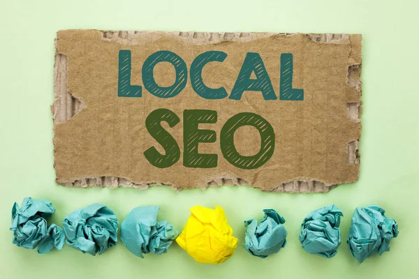 Conceptual hand writing showing Local Seo. Business photo text Search Engine Optimization Strategy Optimize Local Find Keywords written on Tear Cardboard on plain background Crumpled Paper Balls. — Stock Photo, Image