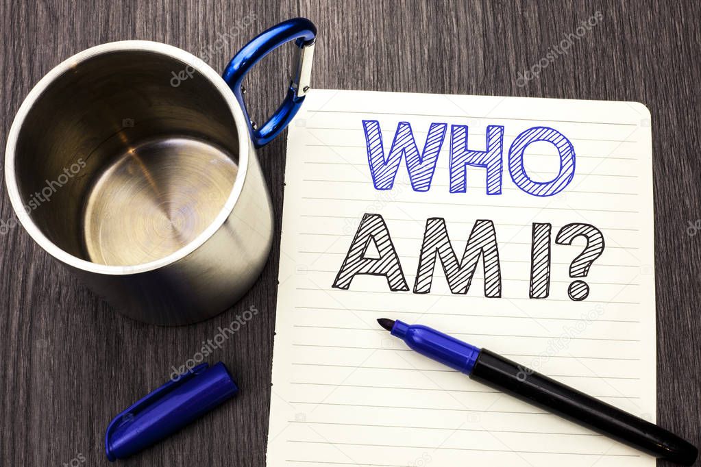Conceptual hand writing showing Who Am I Question. Business photo showcasing Question Asked Identity Thinking Doubt Psycology Mystery written on Notebook Paper wooden background Marker and Cup
