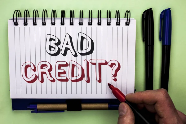 Writing note showing  Bad Credit Question. Business photo showcasing Low Credit Finance Economic Budget Asking Questionaire written by Man Holding Marker on Nootbook Book plain background Marker. — Stock Photo, Image