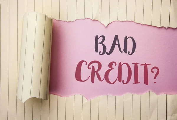 Writing note showing  Bad Credit Question. Business photo showcasing Low Credit Finance Economic Budget Asking Questionaire written on the pink background behind Tear Notebook Paper. — Stock Photo, Image