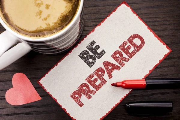 Text sign showing Be Prepared. Conceptual photo Preparedness Challenge Opportunity Prepare Plan Management written on Sticky Note on the wooden background Coffee Cup Heart Marker next to it. — Stock Photo, Image