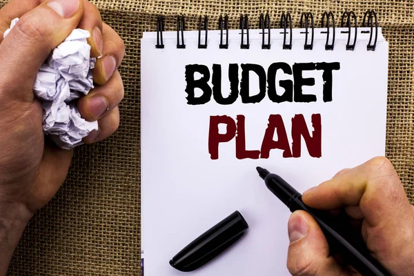 Word writing text Budget Plan. Business concept for Accounting Strategy Budgeting Financial Revenue Economics written by Man Holding Marker on Notebook Book on the jute background. — Stock Photo, Image