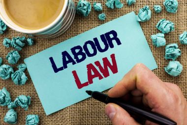 Writing note showing  Labour Law. Business photo showcasing Employment Rules Worker Rights Obligations Legislation Union written by Man Holding Pen on Sticky Note Paper the jute background Cup clipart