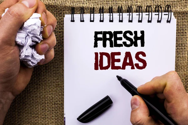 Word writing text Fresh Ideas. Business concept for Creative Vision Thinking Imagination Concept Strategy  written by Man Holding Marker on Notebook Book on the jute background.