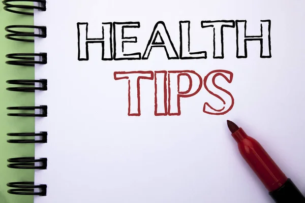 Handwriting text Health Tips. Concept meaning Healthy Suggestions Suggest Information Guidance Tip Idea written on Notebook Book on the plain background Marker next to it.