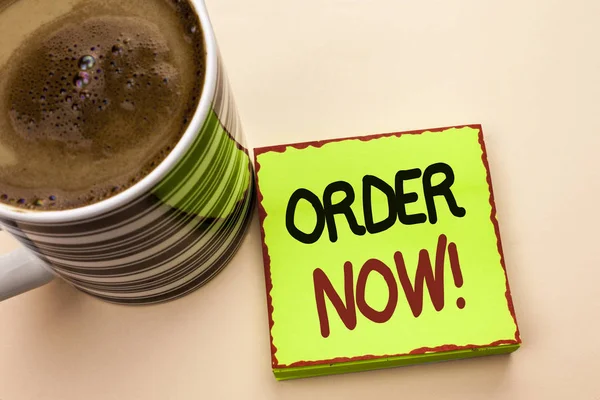 Word writing text Order Now. Business concept for Buy Purchase Order Deal Sale Promotion Shop Product Register written on Green Sticky Note Paper on the plain background Coffee Cup next to it.