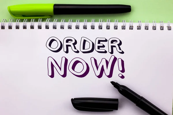 Conceptual hand writing showing Order Now. Business photo showcasing Buy Purchase Order Deal Sale Promotion Shop Product Register written on Notebook Book on the Plain background Marker Pen