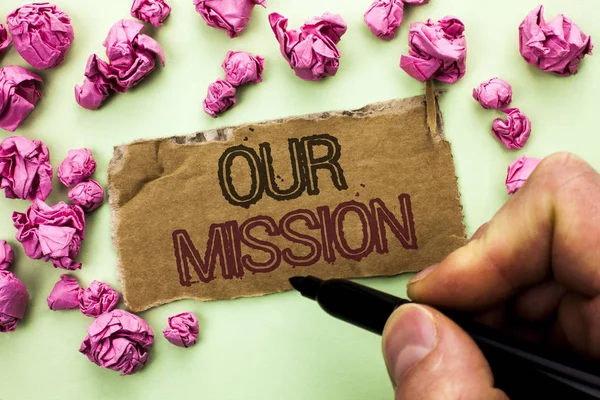 Writing note showing  Our Mission. Business photo showcasing Goal Motivation Target Growth Planning Innovation Vision written by Man Holding Marker on Tear Cardboard Piece plain background. — Stock Photo, Image