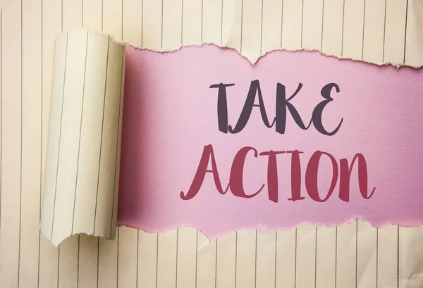 Writing note showing  Take Action. Business photo showcasing Strategy Future Actions Procedure Activity Goal Objective written on the pink background behind Tear Notebook Paper.