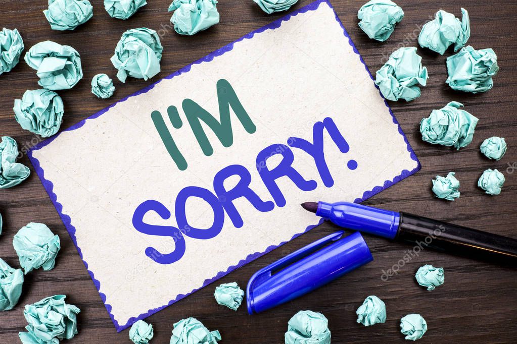 Writing note showing  I m Sorry. Business photo showcasing Apologize Conscience Feel Regretful Apologetic Repentant Sorrowful written on Cardboard Piece on the wooden background Marker next to it.