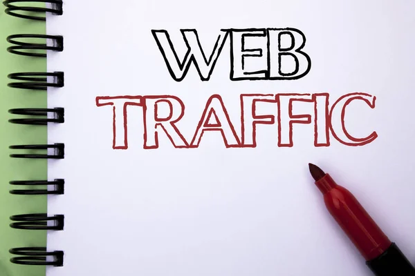 Handwriting text Web Traffic. Concept meaning Internet Boost Visitors Audience Visits Customers Viewers written on Notebook Book on the plain background Marker next to it.