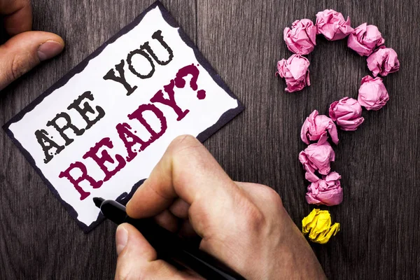 Conceptual hand writing showing Are You Ready Question. Business photo text Be Prepared Motivated Warned Readiness Aware written by Man on Sticky Note Holding Pen Wooden background Ask for — Stock Photo, Image