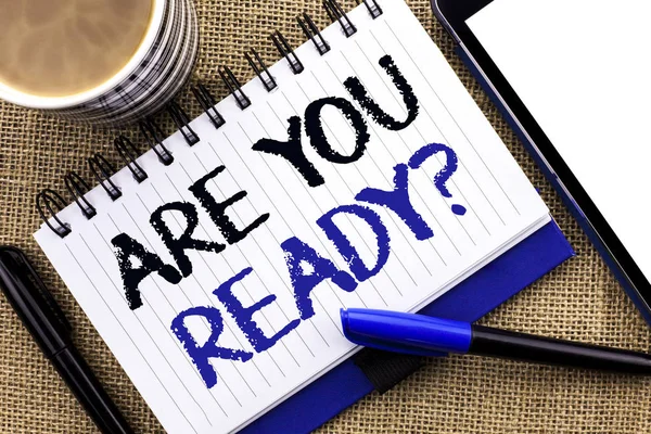 Text sign showing Are You Ready Question. Conceptual photo Be Prepared Motivated Warned Readiness Aware written on Notebook Book on the jute background Tablet Coffee Cup and Pens next to it — Stock Photo, Image