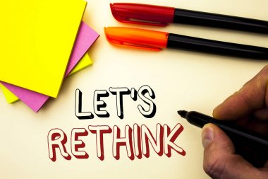 Handwriting text writing Let Us Rethink. Concept meaning Give people time to think things again Remodel Redesign written by Marker on the plain background Pen and Sticky Notes next to it. clipart