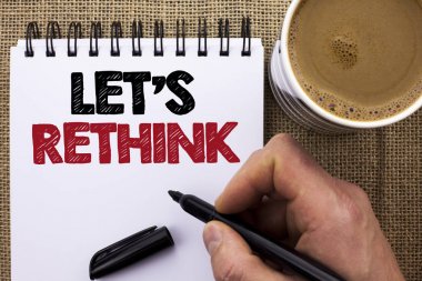 Text sign showing Let Us Rethink. Conceptual photo Give people time to think things again Remodel Redesign written by Man Holding Marker on Notebook Book on the jute background Coffee Cup. clipart