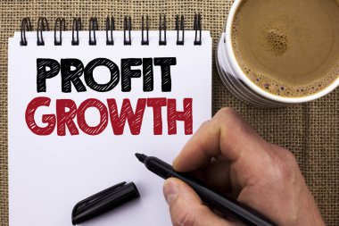 Kar büyüme gösterilen metin işareti. Kavramsal fotoğraf finansal başarı artan gelirleri evrim adam tutarak Marker tarafından defter kitap jüt özgeçmişlerine kahve fincanı yazılı geliştirme.