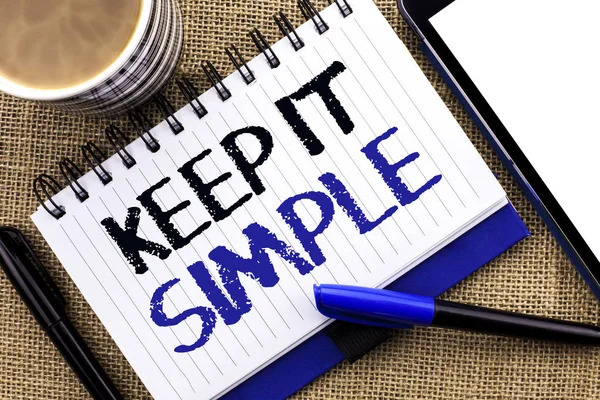 Text sign showing Keep It Simple. Conceptual photo Simplify Things Easy Understandable Clear Concise Ideas written on Notebook Book on the jute background Tablet Coffee Cup and Pens next to it — Stock Photo, Image