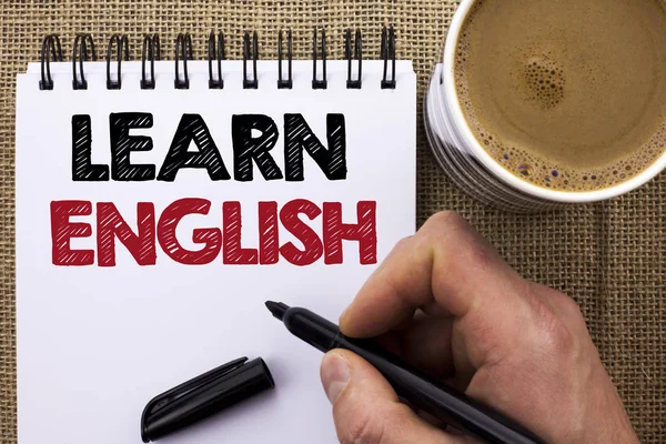 Text sign showing Learn English. Conceptual photo Study another Language Learn Something Foreign Communication written by Man Holding Marker on Notebook Book on the jute background Coffee Cup. — Stock Photo, Image